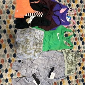 Various assortment of workout tops. Various brands Nike, adidas, pink, mono b